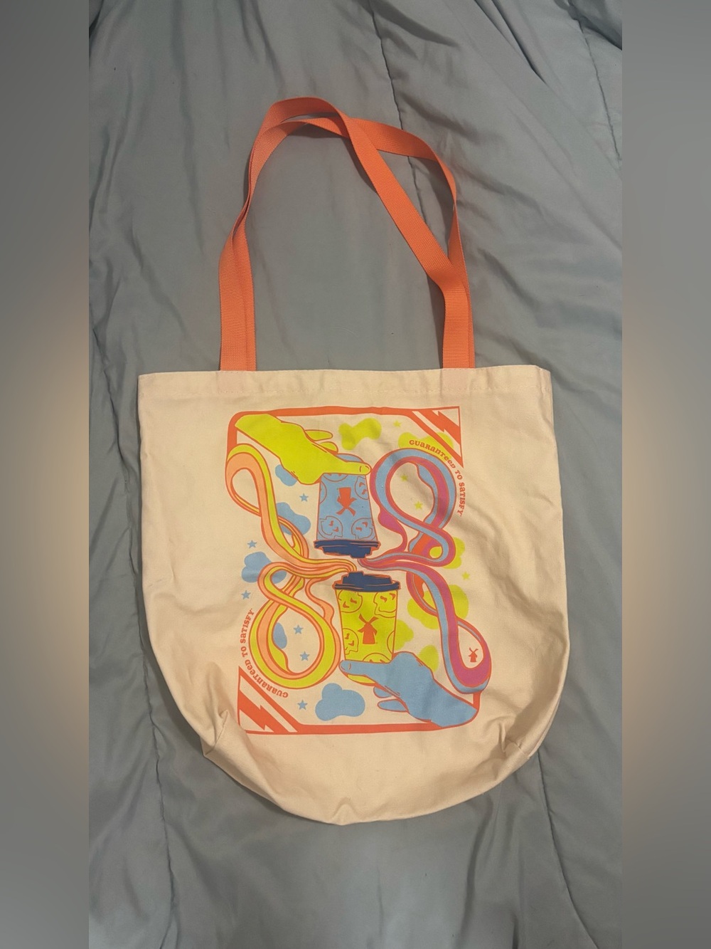 DUTCH BROS
Canvas Tote Bag with Orange Straps and Smiley Cup Graphic - Picture 2 of 3